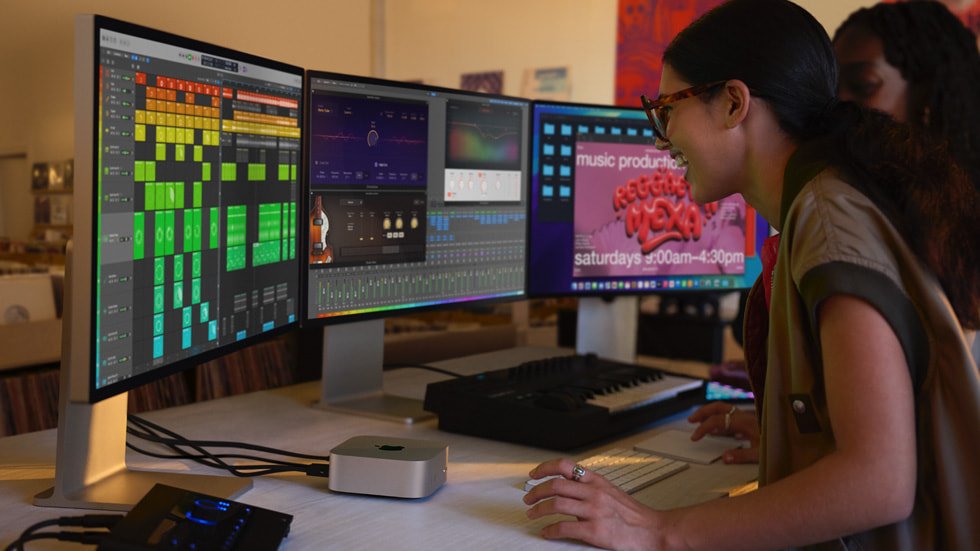 two girls using compueter with the help of mac mini